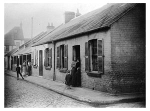 Athlone Place, Ultimo, c.1900. Athlone Place was resumed by Council in 1906, when some 400 dwellings and a maze of tiny lanes were removed. The area was subject to flooding and it was considered a deplorable slum. This photo shows two groups of semi-detached, single-storey buildings, with neighbours and children standing in their doorways chatting. (image: City of Sydney Archives, CRS 51/6) http://history.cityofsydney.nsw.gov.au/sydneystreets/Lost_Streets/Laneways/51_1_6.html